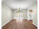 Clean and spacious dining area with wood-look floors and access to the kitchen, providing a neutral and functional design at 10739 Se 44Th Ter, Belleview, FL 34420