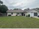 Charming single-story home featuring a well-maintained lawn and an attached garage at 10739 Se 44Th Ter, Belleview, FL 34420