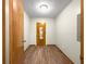 Hallway featuring a clean interior and wood flooring at 10739 Se 44Th Ter, Belleview, FL 34420
