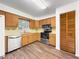 Well-lit kitchen with stainless steel appliances and wood cabinets at 10739 Se 44Th Ter, Belleview, FL 34420