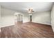 Expansive living room featuring wood-look floors, neutral paint, and great natural light, ready for customization at 10739 Se 44Th Ter, Belleview, FL 34420