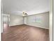 Large living room with wood-look floors and natural light provides an open space for comfortable living and entertaining at 10739 Se 44Th Ter, Belleview, FL 34420