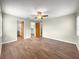 Main bedroom featuring wood floors, ensuite bathroom, and walk-in closet at 10739 Se 44Th Ter, Belleview, FL 34420