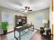 Office space with a large desk, shelving, and a window for natural light at 10739 Se 44Th Ter, Belleview, FL 34420