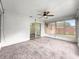 Light-filled sunroom featuring tile floors, ceiling fan, and sliding glass door at 10739 Se 44Th Ter, Belleview, FL 34420