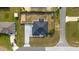 Aerial view of the property showing the layout of the house, driveway, and surrounding landscape at 13115 Sw 49Th Ave, Ocala, FL 34473