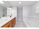 Bathroom featuring a double vanity, soaking tub, and updated fixtures at 13115 Sw 49Th Ave, Ocala, FL 34473