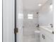 Bright bathroom features a shower-tub combination and updated white vanity at 13115 Sw 49Th Ave, Ocala, FL 34473
