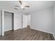 Spacious bedroom featuring wood-look floors, ceiling fan, closet, and neutral paint at 13115 Sw 49Th Ave, Ocala, FL 34473