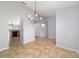 Light and airy dining room with modern chandelier and tile flooring at 13115 Sw 49Th Ave, Ocala, FL 34473
