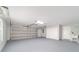 Spacious garage with painted floor, storage, and garage door opener at 13115 Sw 49Th Ave, Ocala, FL 34473