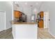 Bright kitchen with granite counters, stainless appliances and views into the living room at 13115 Sw 49Th Ave, Ocala, FL 34473