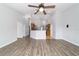 Living space with views to the kitchen, high ceilings and contemporary ceiling fan at 13115 Sw 49Th Ave, Ocala, FL 34473