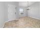 Inviting entry features neutral tile and a classic chandelier lighting the open, bright space at 13115 Sw 49Th Ave, Ocala, FL 34473