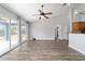 Bright living room featuring sliding doors to the lanai, high ceilings and access to kitchen at 13115 Sw 49Th Ave, Ocala, FL 34473