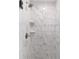 Close up of the walk-in shower with marble-style tiles and shower niche at 13115 Sw 49Th Ave, Ocala, FL 34473
