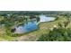 Scenic aerial view of community lake and golf course creating a picturesque and desirable neighborhood at 15 Sunrise Dr, Ocala, FL 34472