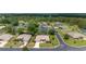 Aerial view of a quiet residential street showcasing well-maintained homes and mature trees at 15 Sunrise Dr, Ocala, FL 34472