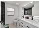 Modern bathroom featuring double sinks, sleek black fixtures, and contemporary finishes at 15 Sunrise Dr, Ocala, FL 34472