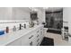 Modern bathroom with double vanity, sleek fixtures, and glass-enclosed shower at 15 Sunrise Dr, Ocala, FL 34472