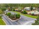 View of the community entrance featuring lush landscaping, signage, and manicured grounds at 15 Sunrise Dr, Ocala, FL 34472