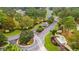 View of the community entrance with lush landscaping and a welcoming gate house at 15 Sunrise Dr, Ocala, FL 34472