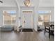 Bright foyer with modern flooring, transom windows, and views of the main living area at 15 Sunrise Dr, Ocala, FL 34472
