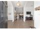 Inviting foyer featuring hardwood floors, arched doorways, and a view into the living room at 15 Sunrise Dr, Ocala, FL 34472