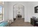 Hallway with arched doorways leading to dining room and living areas at 15 Sunrise Dr, Ocala, FL 34472