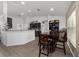 Eat-in kitchen with dark cabinetry, stainless appliances, and counter seating at 15 Sunrise Dr, Ocala, FL 34472