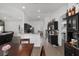 Open floor plan showcasing the kitchen with bar seating and stainless steel appliances at 15 Sunrise Dr, Ocala, FL 34472
