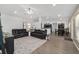Expansive living area showcasing hardwood floors and an open design connecting the kitchen and dining spaces at 15 Sunrise Dr, Ocala, FL 34472
