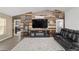 Comfortable living room featuring a wood accent wall, large TV, and stylish decor at 15 Sunrise Dr, Ocala, FL 34472