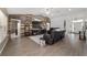 Comfortable living room featuring hardwood floors, a ceiling fan, and access to the front entry at 15 Sunrise Dr, Ocala, FL 34472