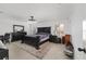 Main bedroom features a dark wood bed frame, neutral walls, and an area rug at 15 Sunrise Dr, Ocala, FL 34472