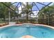 Backyard features a screened-in pool with mature palms and a serene atmosphere at 15 Sunrise Dr, Ocala, FL 34472