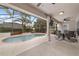 Screened-in pool and patio area features a spillover and an outdoor dining area, perfect for entertaining at 15 Sunrise Dr, Ocala, FL 34472