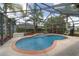 Backyard features a screened-in pool and patio area with mature palms and privacy landscaping at 15 Sunrise Dr, Ocala, FL 34472