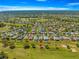 Stunning aerial view of the golf course community, showcasing the well-maintained homes and lush green landscape at 15825 Sw 11Th Court Rd, Ocala, FL 34473