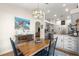 Inviting dining area with chandelier lighting and adjacent kitchen view; great for Gathering gatherings at 15825 Sw 11Th Court Rd, Ocala, FL 34473