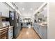 Bright kitchen featuring stainless steel appliances and tile flooring, offering ample counter space at 15825 Sw 11Th Court Rd, Ocala, FL 34473