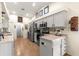 Contemporary kitchen with gray cabinets and stainless steel appliances, ideal for cooking and entertaining at 15825 Sw 11Th Court Rd, Ocala, FL 34473