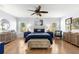 Well-lit bedroom featuring neutral walls, furnishings, tile flooring, and plenty of natural light at 15825 Sw 11Th Court Rd, Ocala, FL 34473
