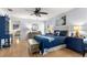 Cozy main bedroom features unique decorations and furniture, a ceiling fan, and an abundance of natural light at 15825 Sw 11Th Court Rd, Ocala, FL 34473