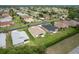 Aerial view of home with backyard screen porch and adjacent homes at 1690 Sw 158Th Ln, Ocala, FL 34473