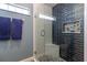 Modern bathroom with a tiled shower featuring stylish glass door and corner seating at 1690 Sw 158Th Ln, Ocala, FL 34473