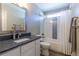 Bathroom boasts modern fixtures and a tiled shower-tub combination with decorative accents at 1690 Sw 158Th Ln, Ocala, FL 34473