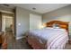 Bedroom showcasing the spacious layout and a view into the adjacent room at 1690 Sw 158Th Ln, Ocala, FL 34473