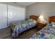 Shared room featuring two twin beds, soft lighting, closet, and a serene ambiance at 1690 Sw 158Th Ln, Ocala, FL 34473