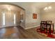 Inviting entryway with light wood-look floors, high ceilings and decorative table with accent mirror at 1690 Sw 158Th Ln, Ocala, FL 34473